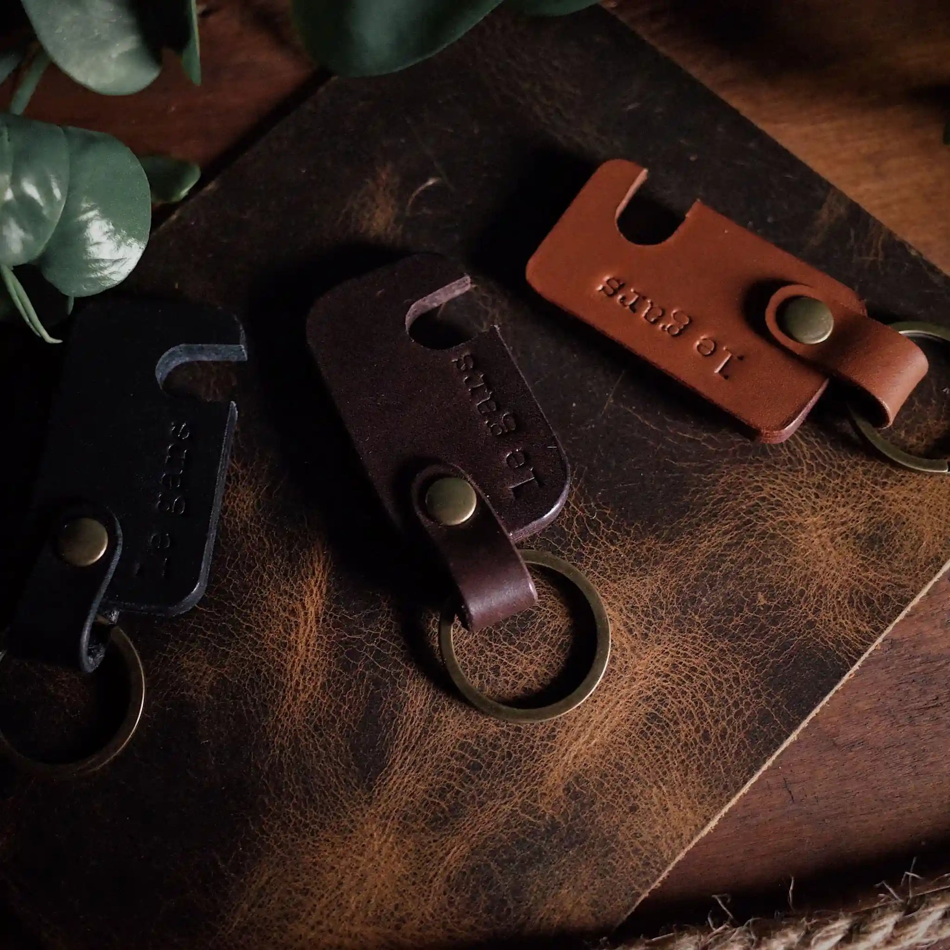 Handmade dark-brown leather keychain phone holder crafted in Montreal
