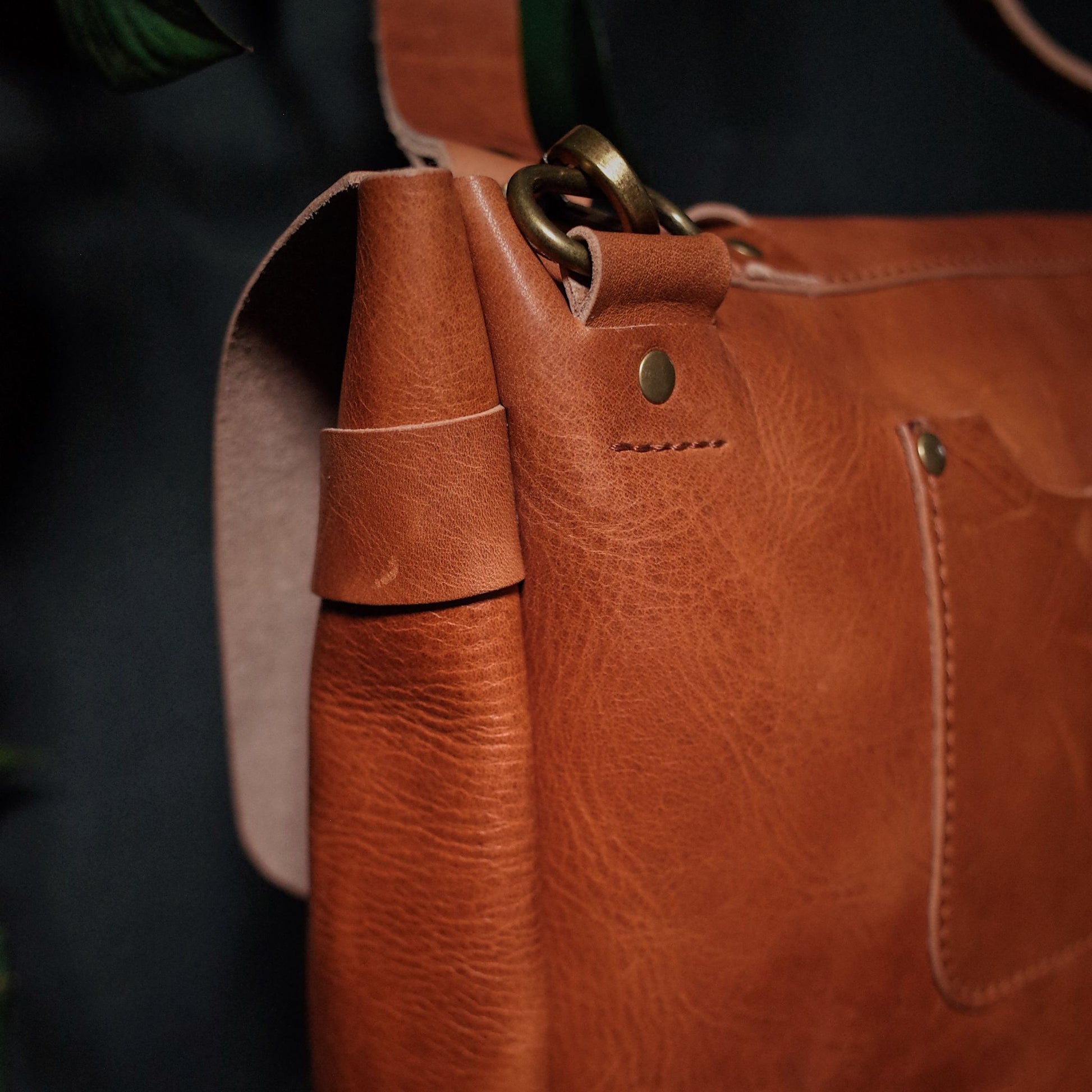 Genuine English tan leather shoulder bag designed for style and function
