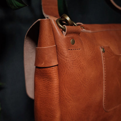 Genuine English tan leather shoulder bag designed for style and function
