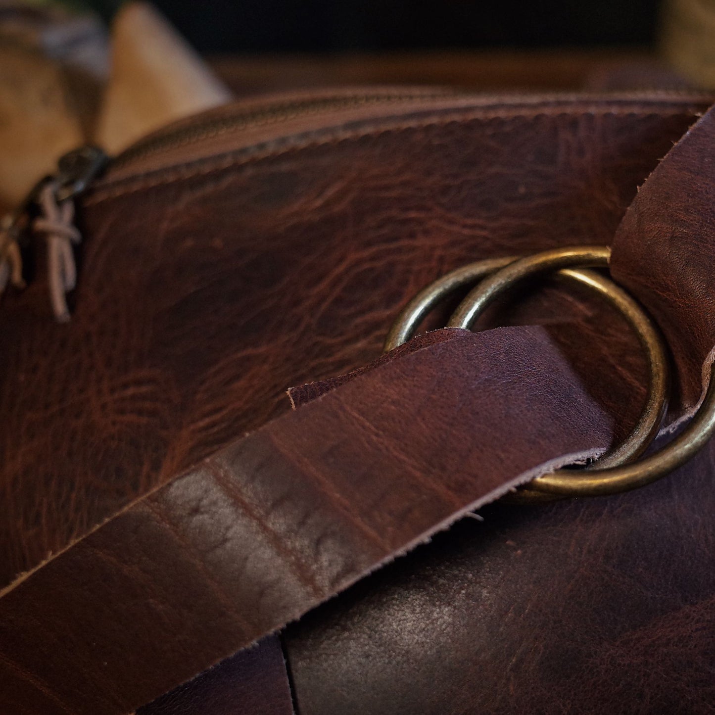 Stylish dark-brown leather fanny pack with adjustable strap and large storage

