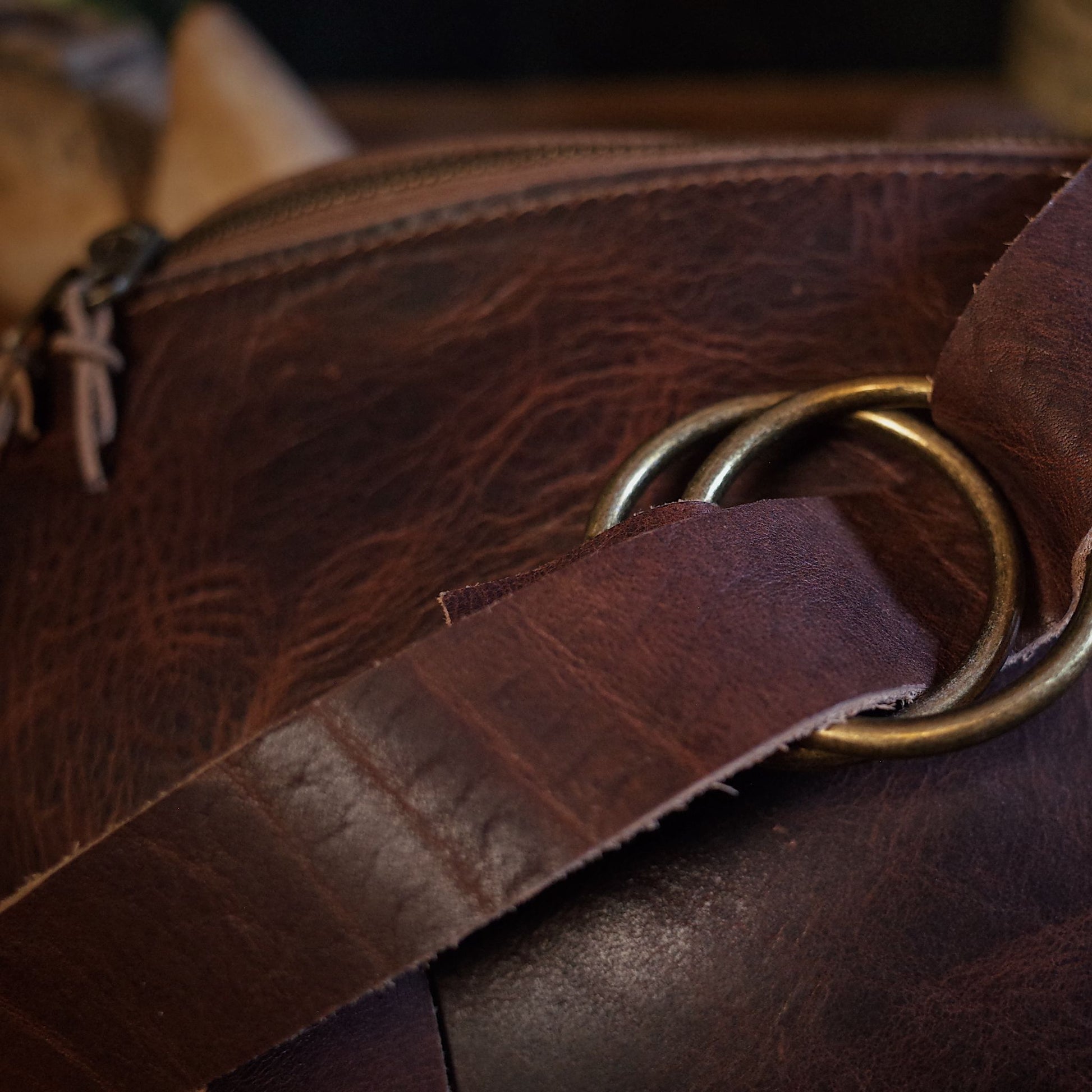 Stylish dark-brown leather fanny pack with adjustable strap and large storage
