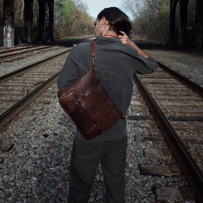 Full-grain dark-brown leather satchel made from sustainable materials
