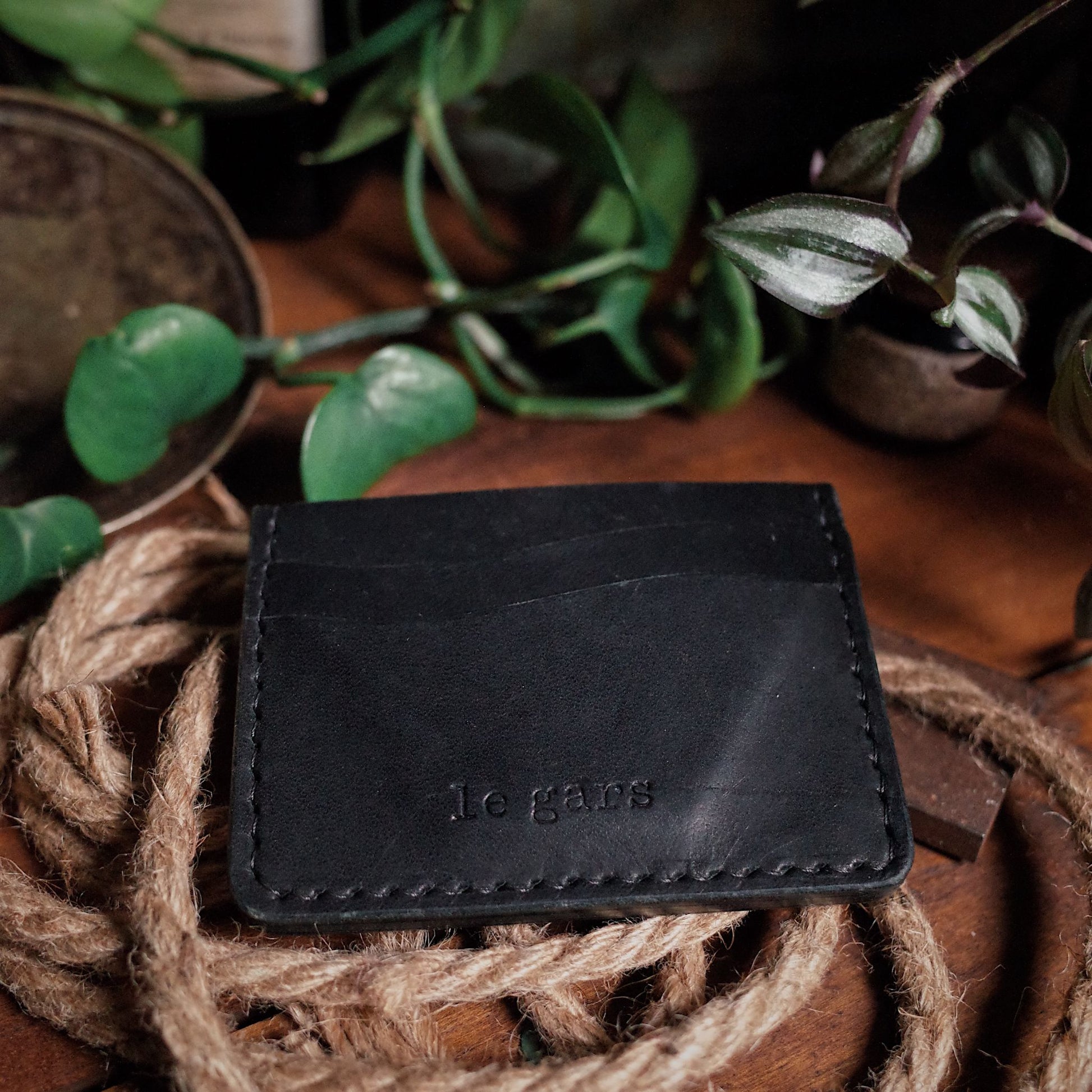 Hand-stitched black leather wallet designed for durability
