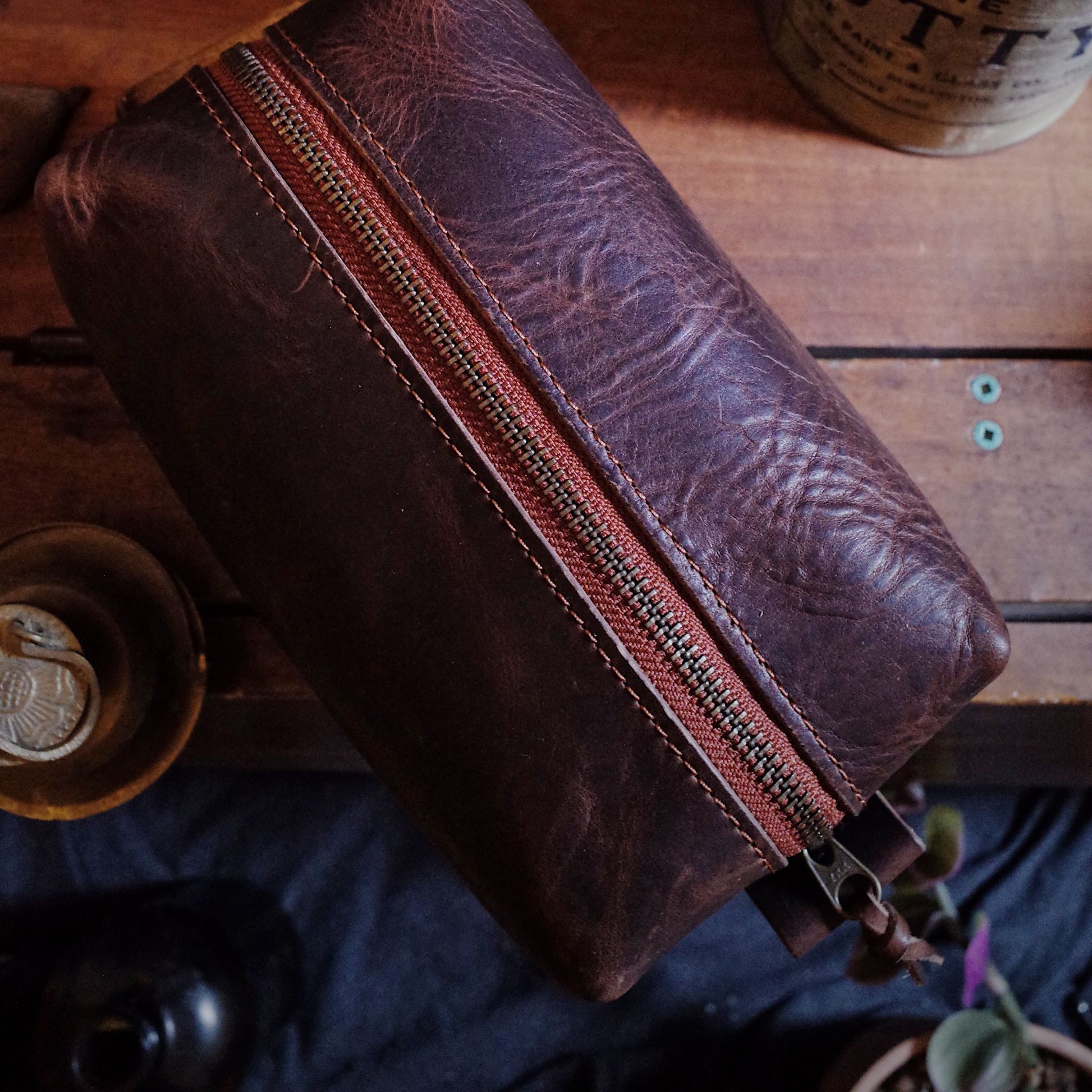 Montreal-made dark-brown leather grooming bag with sleek design

