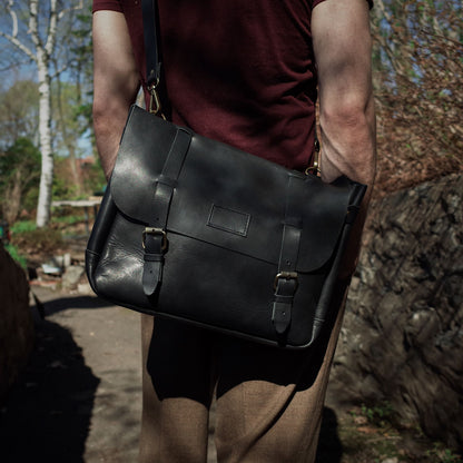 Handmade black leather carryall with minimalist appeal
