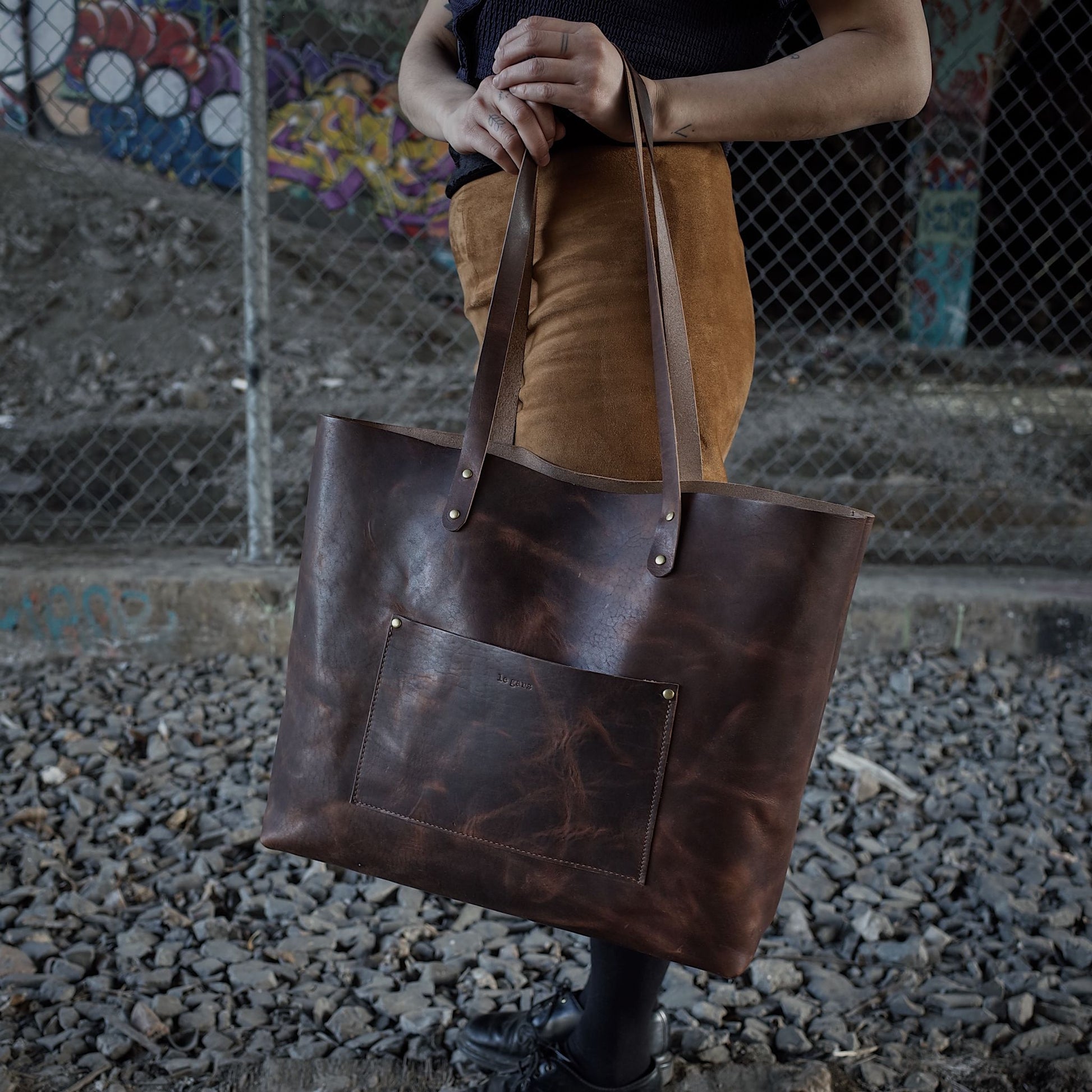 Locally crafted coffee brown leather shoulder bag with custom engraving options
