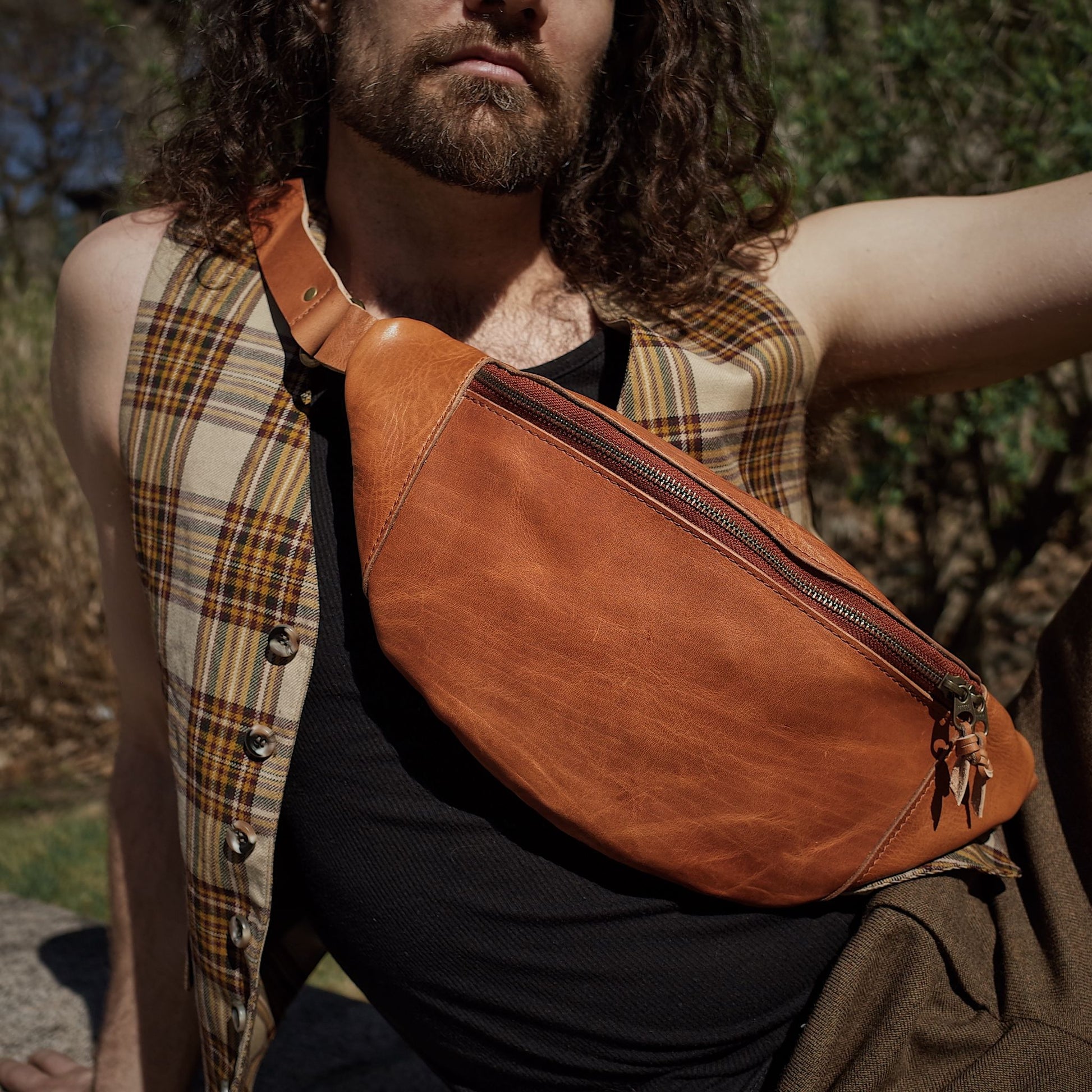 Durable honey brown leather moon bag with extra storage space
