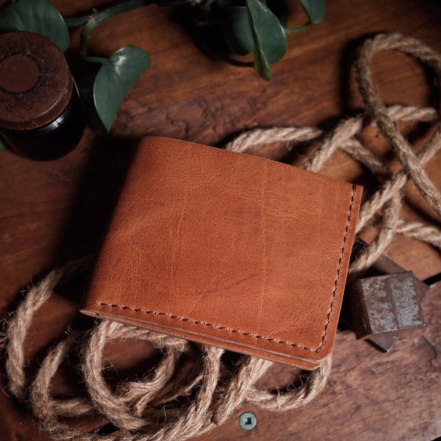 Full-grain saddle tan leather bifold wallet for minimalist fashion
