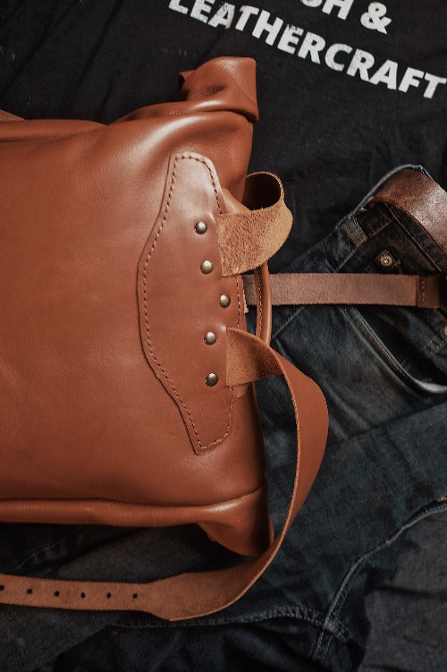 Artisanal honey brown leather roll-top backpack made in Canada
